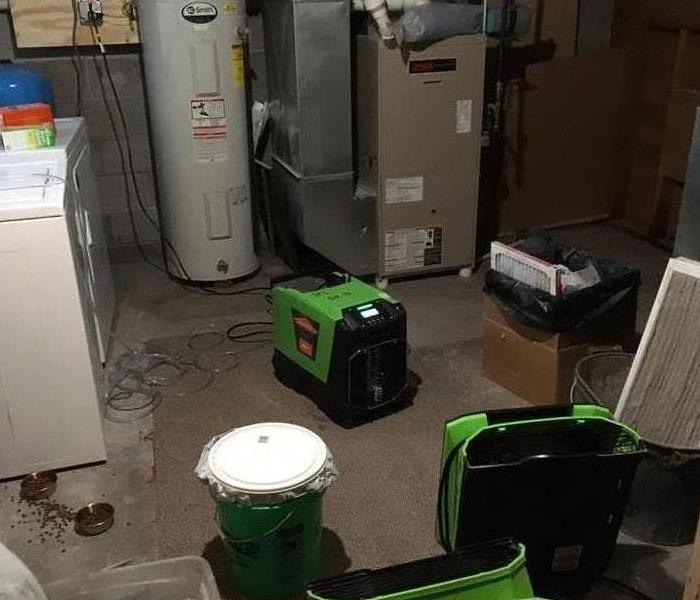 Laundry Room filled with fans for drying water damage