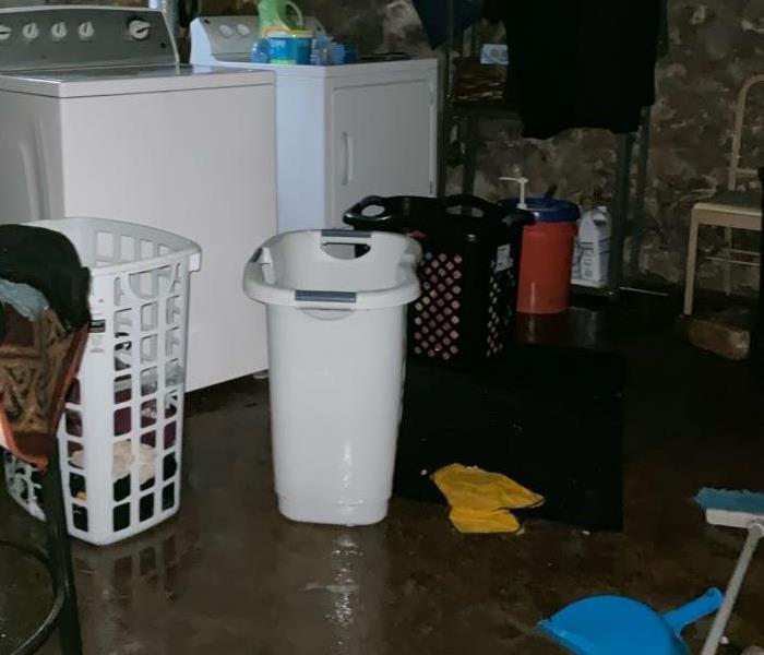 Cement basement structure covered in water from broken pipe