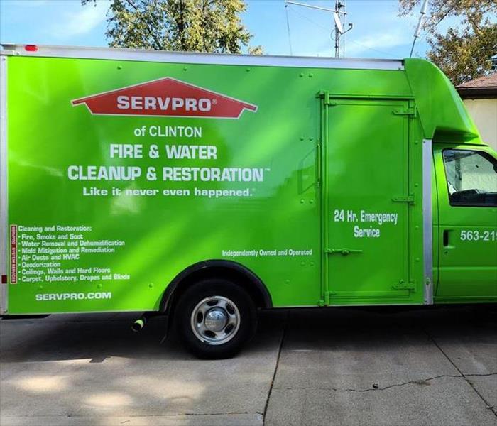 SERVPRO of Clinton is available 24/7 for all commercial and residential needs. Image of green SERVPRO vehicle.